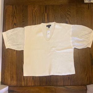 Brand new, short sleeved sweater. White/cream color.